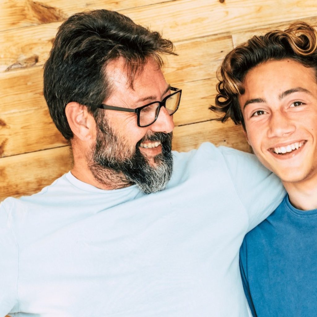 Father and son smiling