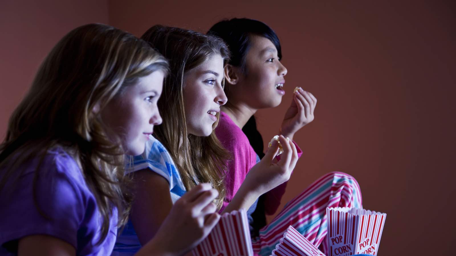 Tween girls watching a movie